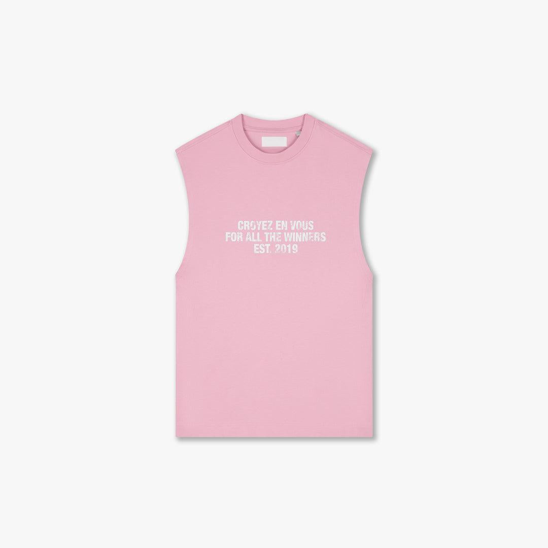 Pink Winners sleeveless t-shirt with "CROYEZ EN VOUS FOR ALL THE WINNERS EST. 2019" text.