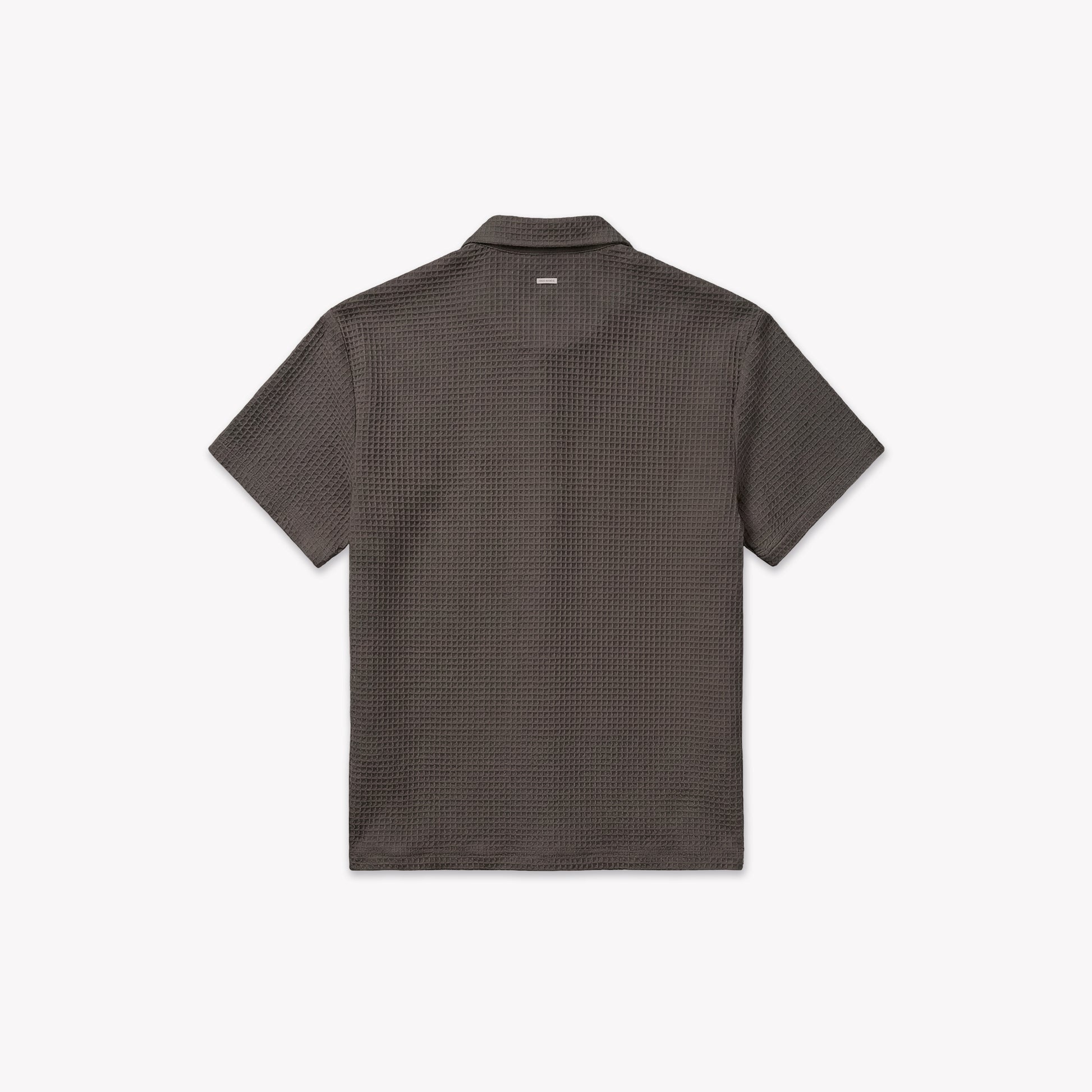 Back view of a washed brown waffle knit short-sleeve shirt with a classic collar.