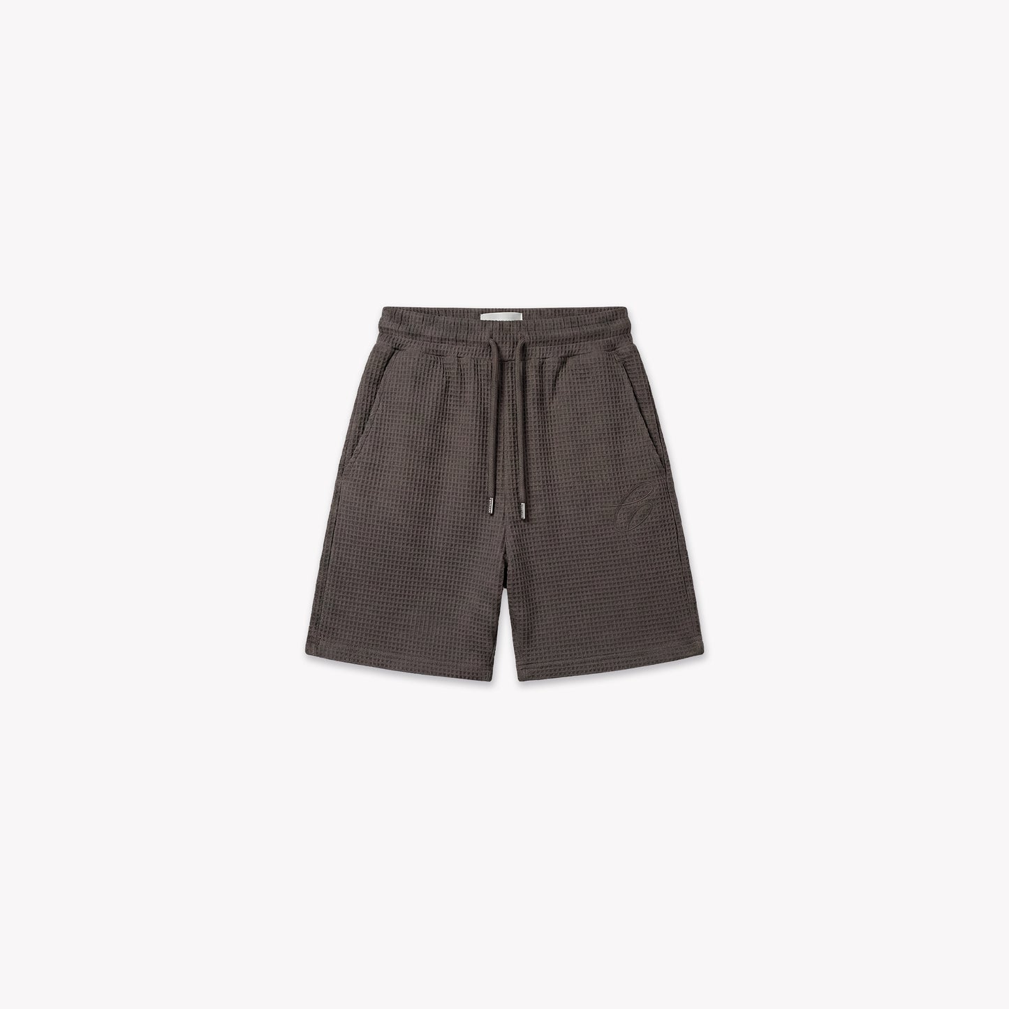 Washed brown waffle knit shorts with drawstring waist, side pockets, and subtle logo detail.