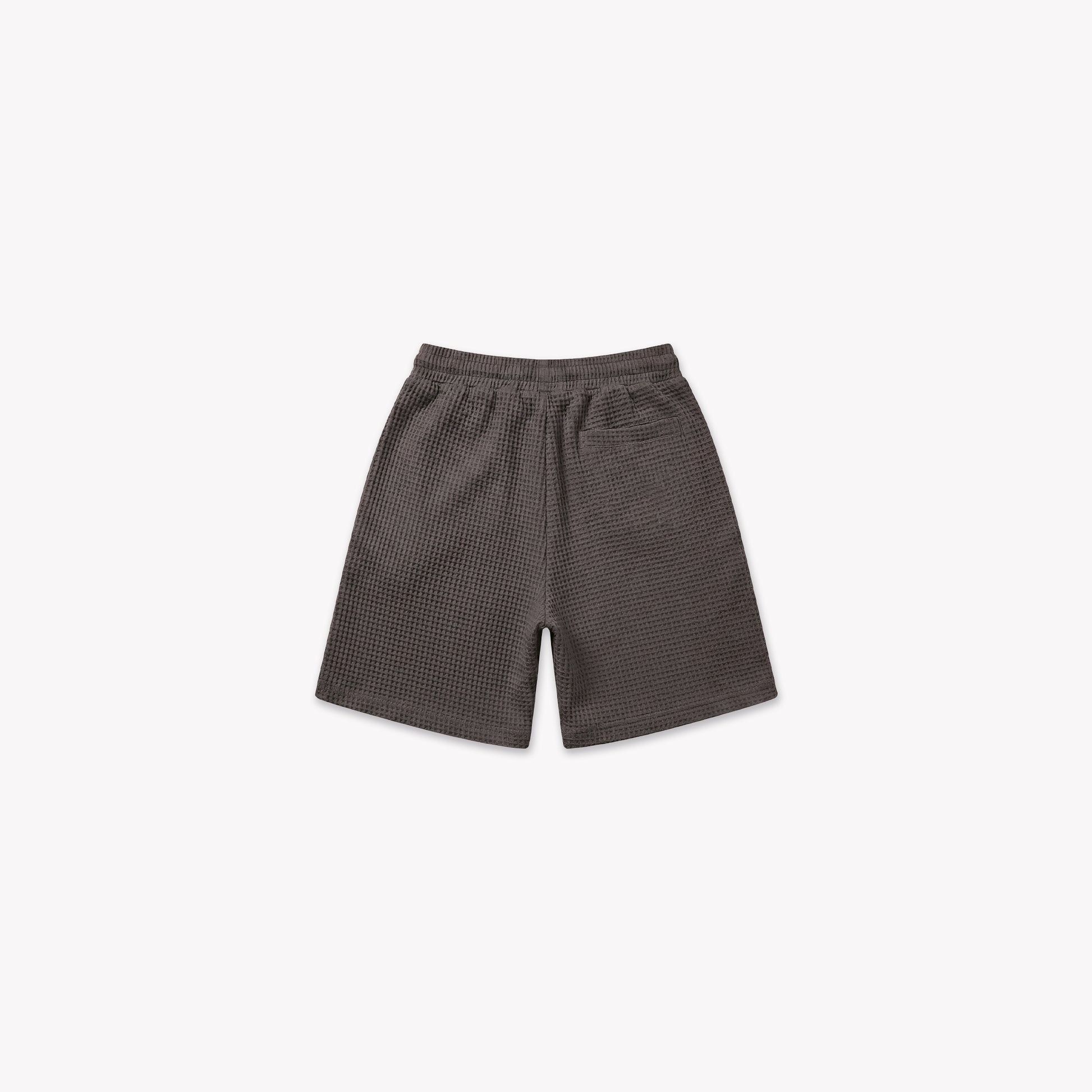 Washed brown waffle knit shorts with an elastic waistband, seen from the front.