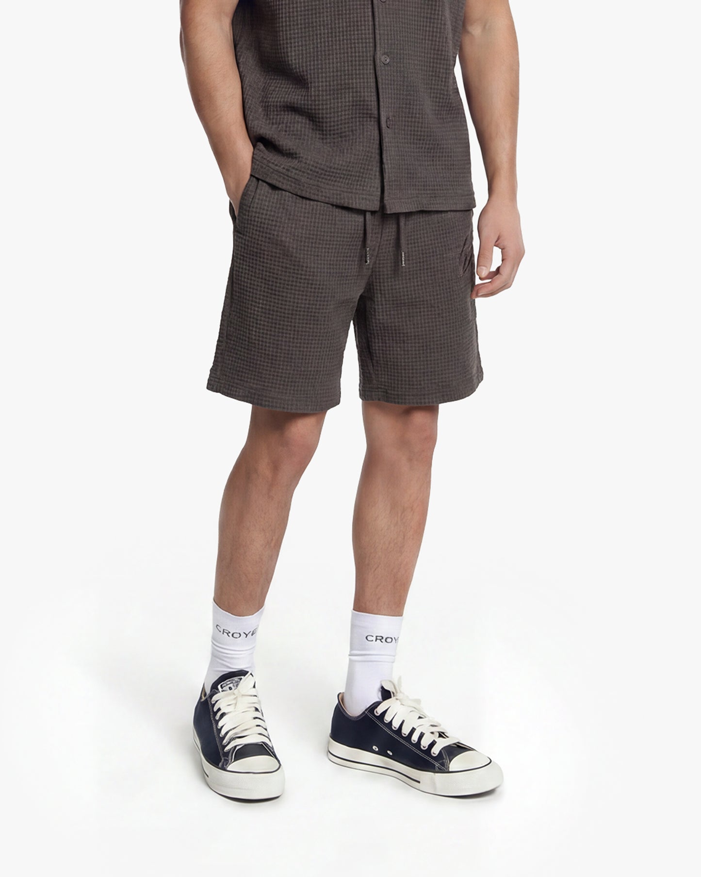Men's Initial Waffle Shorts in Washed Brown, featuring a textured fabric, drawstring waist, and side pockets.