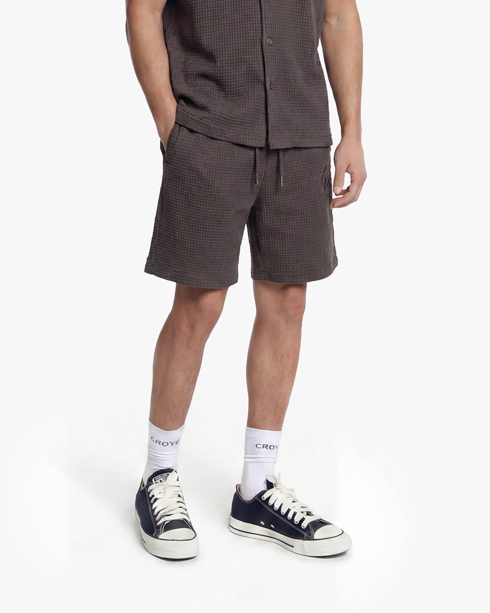 Men's Initial Waffle Shorts in Washed Brown, featuring a textured fabric, drawstring waist, and side pockets.