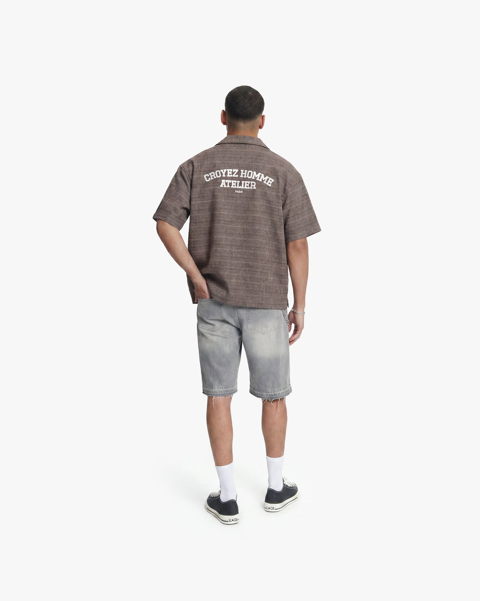 Vintage flannel washed brown shirt with "CROYEZ HOMME ATELIER PARIS" on back, paired with distressed denim shorts.
