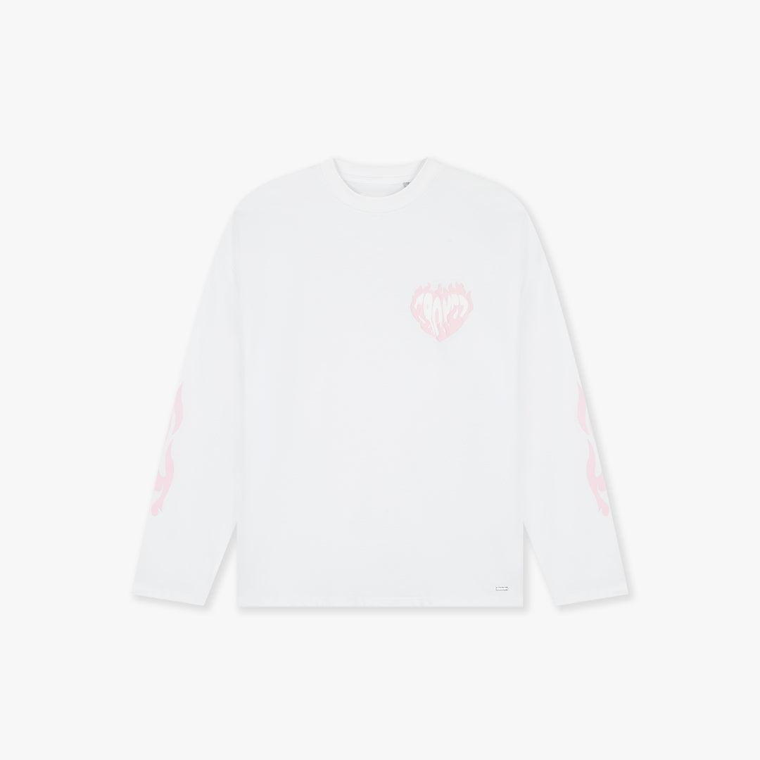 White longsleeve t-shirt with a pink flaming heart graphic on the chest and pink flame details on the sleeves.